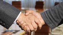 Handshake of two men in suits.